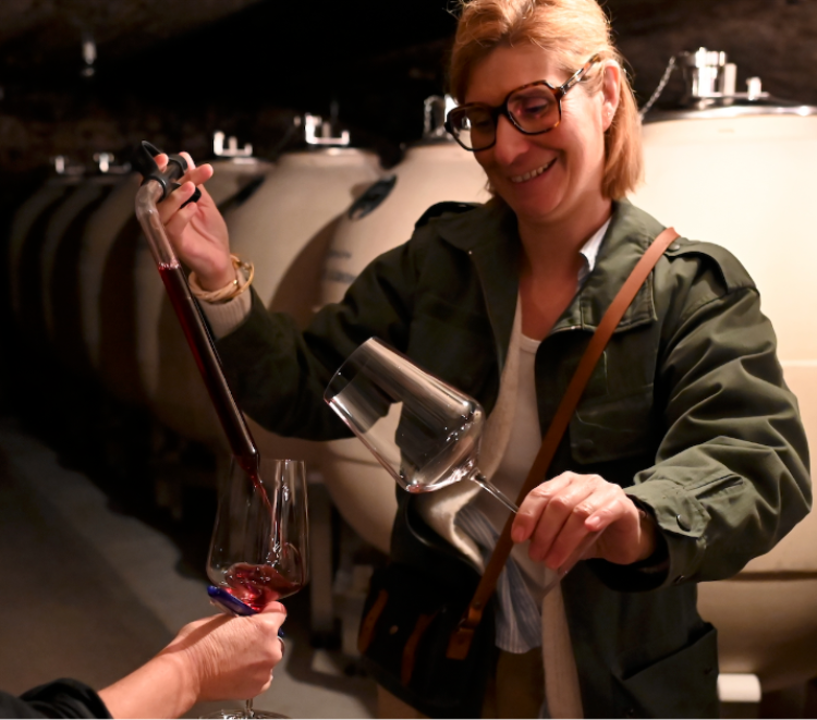 Caroline Parent pours red wine